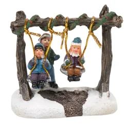 Personnage village de Noël enfants sur balancelle