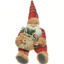 Père-Noël assis à poser décoration