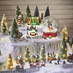 Scène village de Noël lumineuse avec train animé